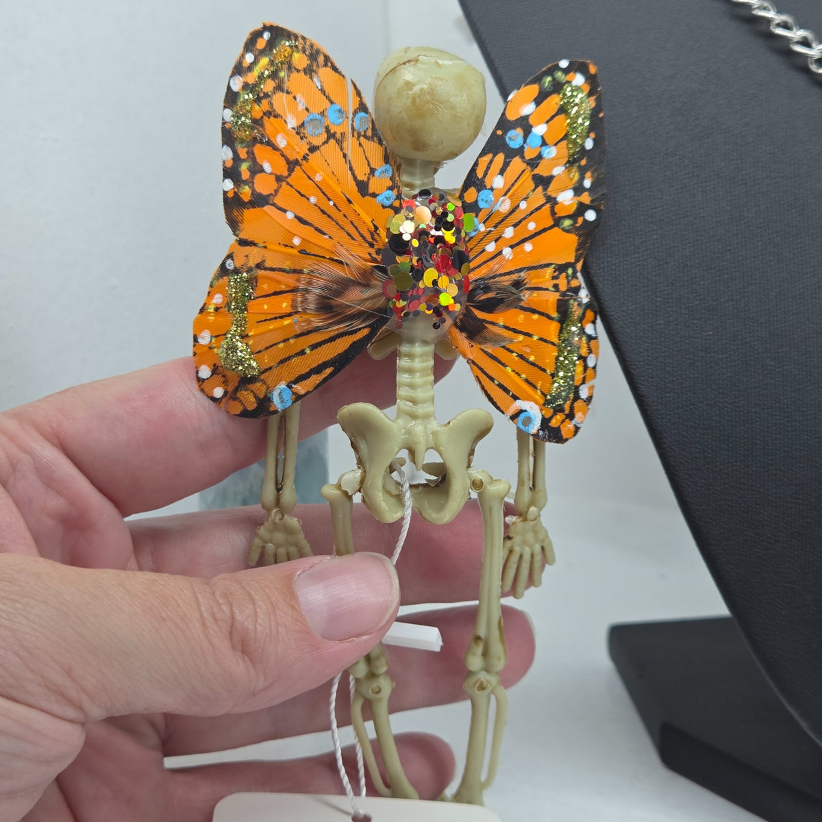 Second view of the orange Dead Fairy curiosity piece by The Velvet Viper