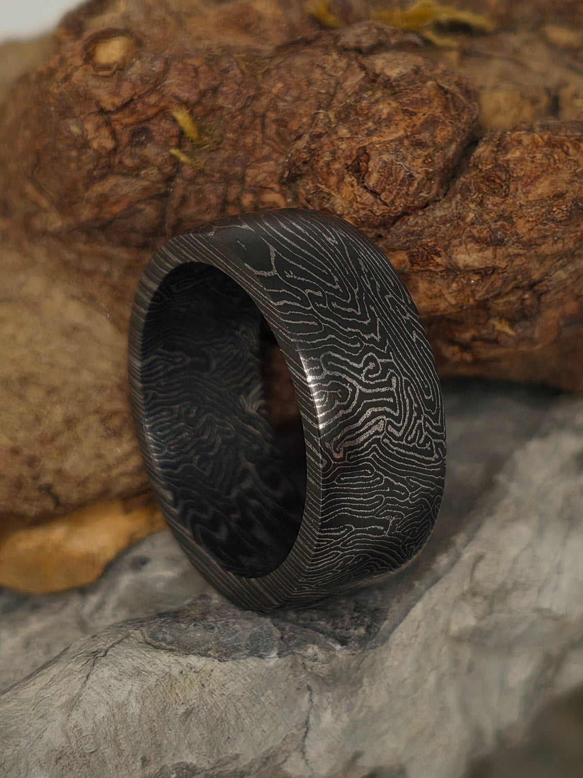 Solid space coral carbon fiber ring by Cameron Senft Designs, size 9, 9mm wide band