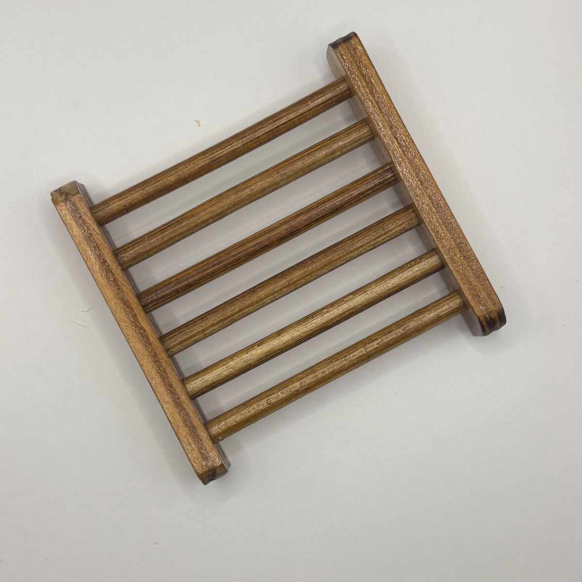 Warm brown wood soap saver tray with drainage slots, from Peaceful Skies