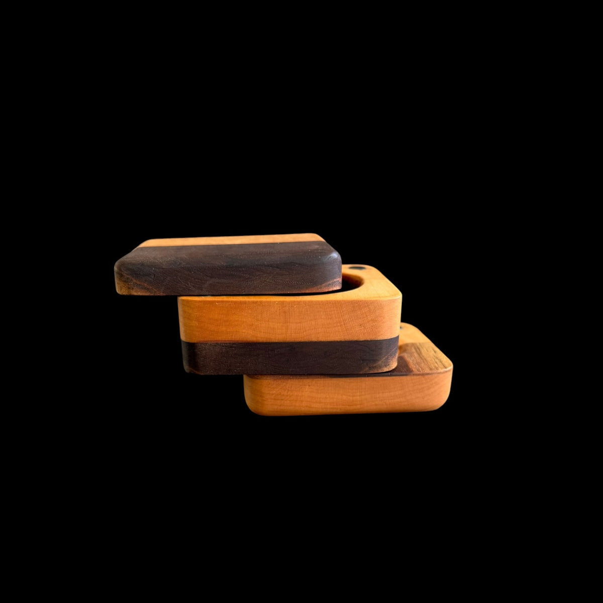 Third view of the magnetic jewelry box with its alternating wood layers aligned