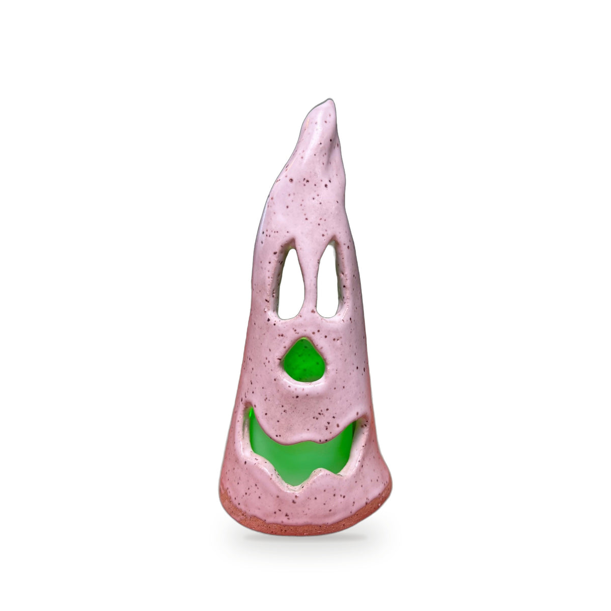 Small handmade pink speckled ceramic ghost luminary with cutout eyes and green glass nose and smile by ABeYOUtifulMind