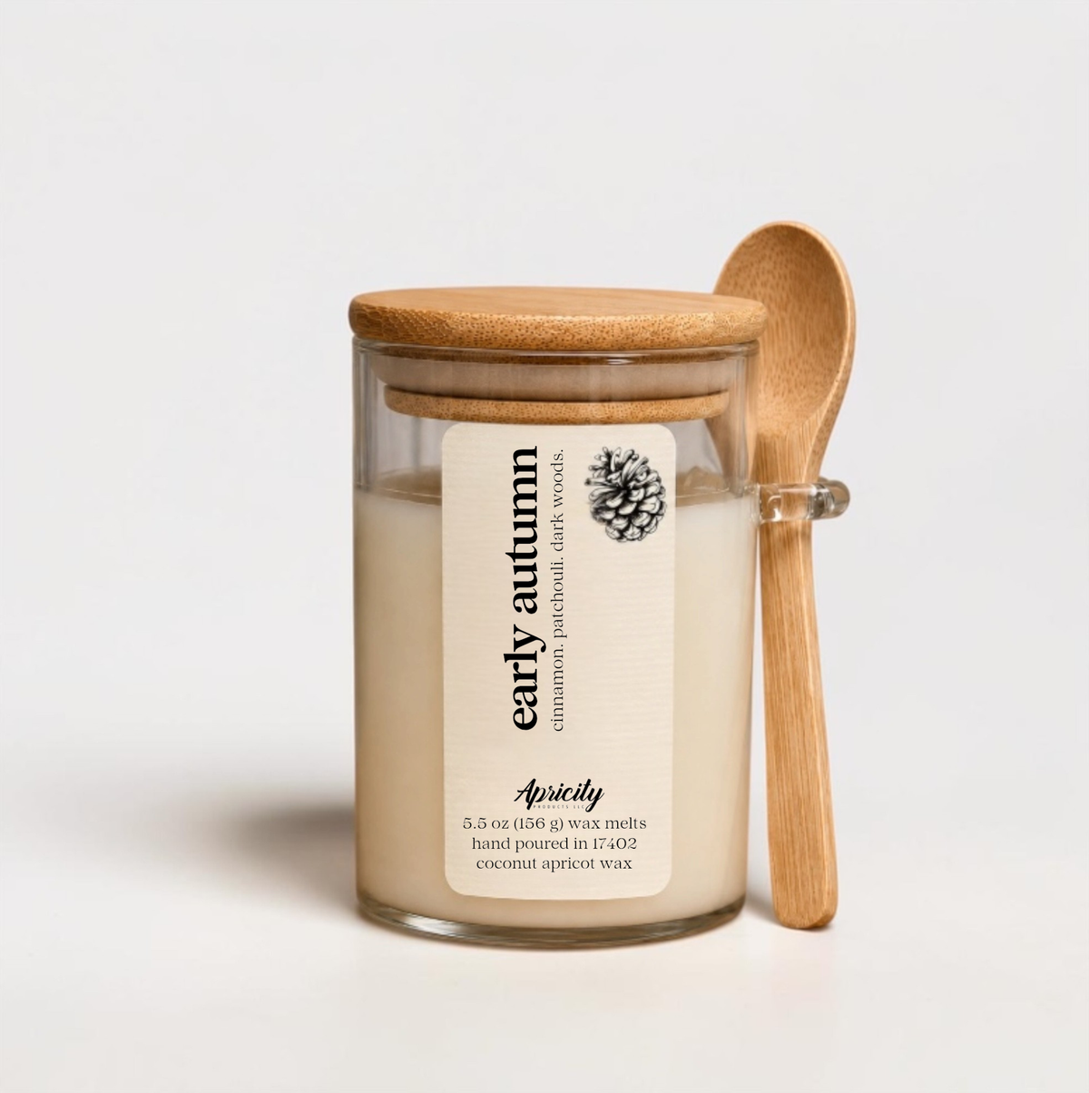 Early Autumn scoopable wax melt in a glass jar with bamboo lid and wooden scoop spoon