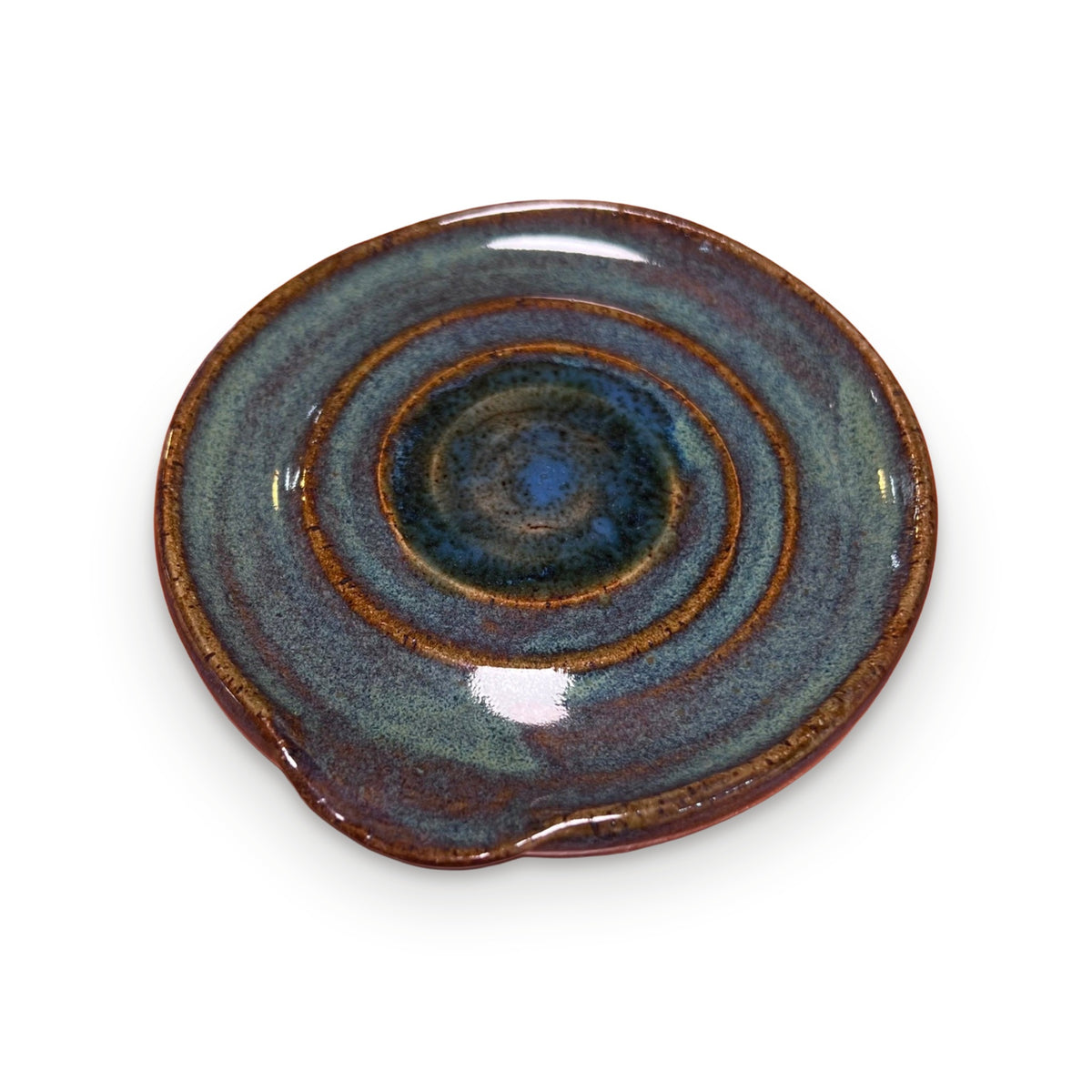 Handmade ceramic spoon rest with blue-green swirl glaze and amber rim by ABeYOUtifulMind