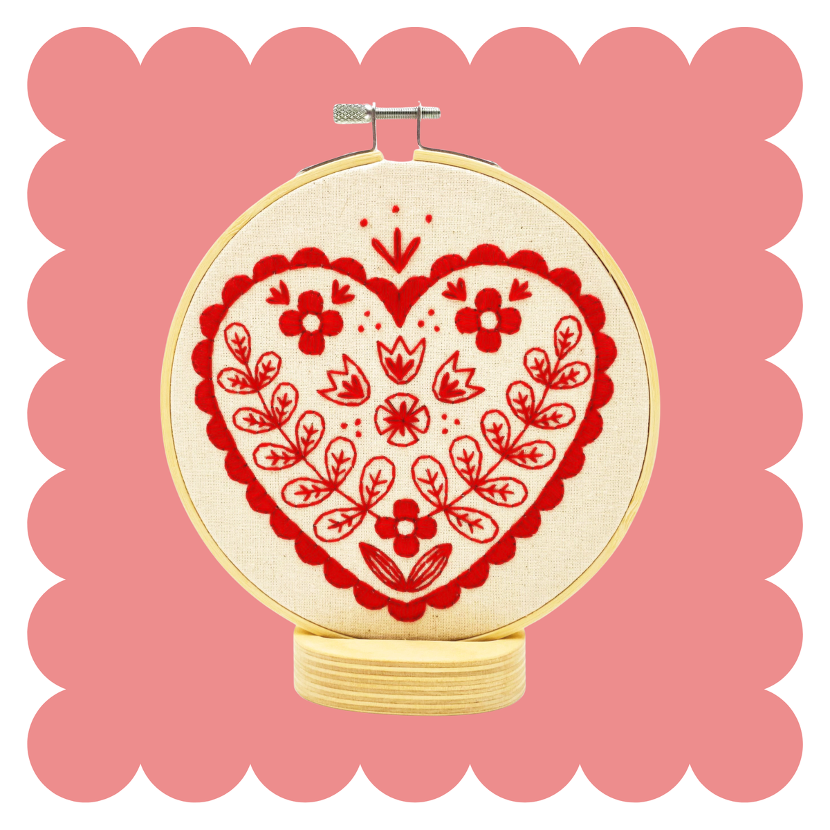 Embroidery hoop with stitched red Scandinavian folk heart