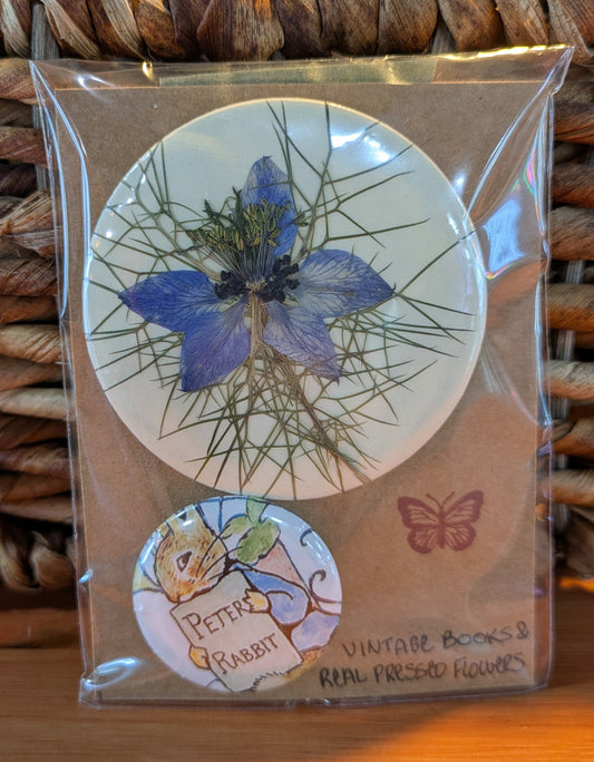 Pin pack of metal-backed pins made with real pressed flowers and vintage book pages by Jaimee Crash Art