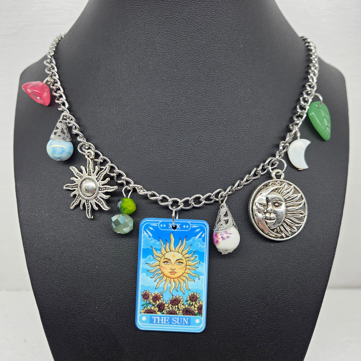 Asymmetrical statement necklace with The Sun tarot card and celestial charms by The Velvet Viper