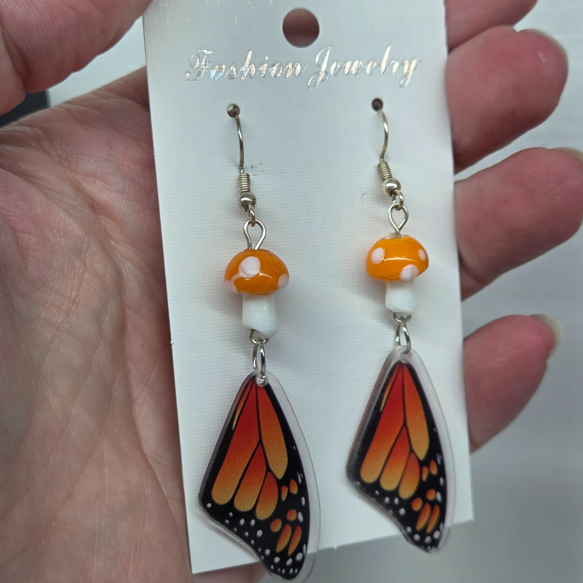 Monarch Moment earrings featuring monarch butterfly wings, handmade by The Velvet Viper