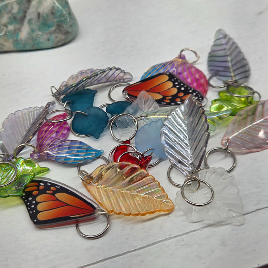 Assorted hair charms including butterfly wings, leaves, moons and stars by The Velvet Viper