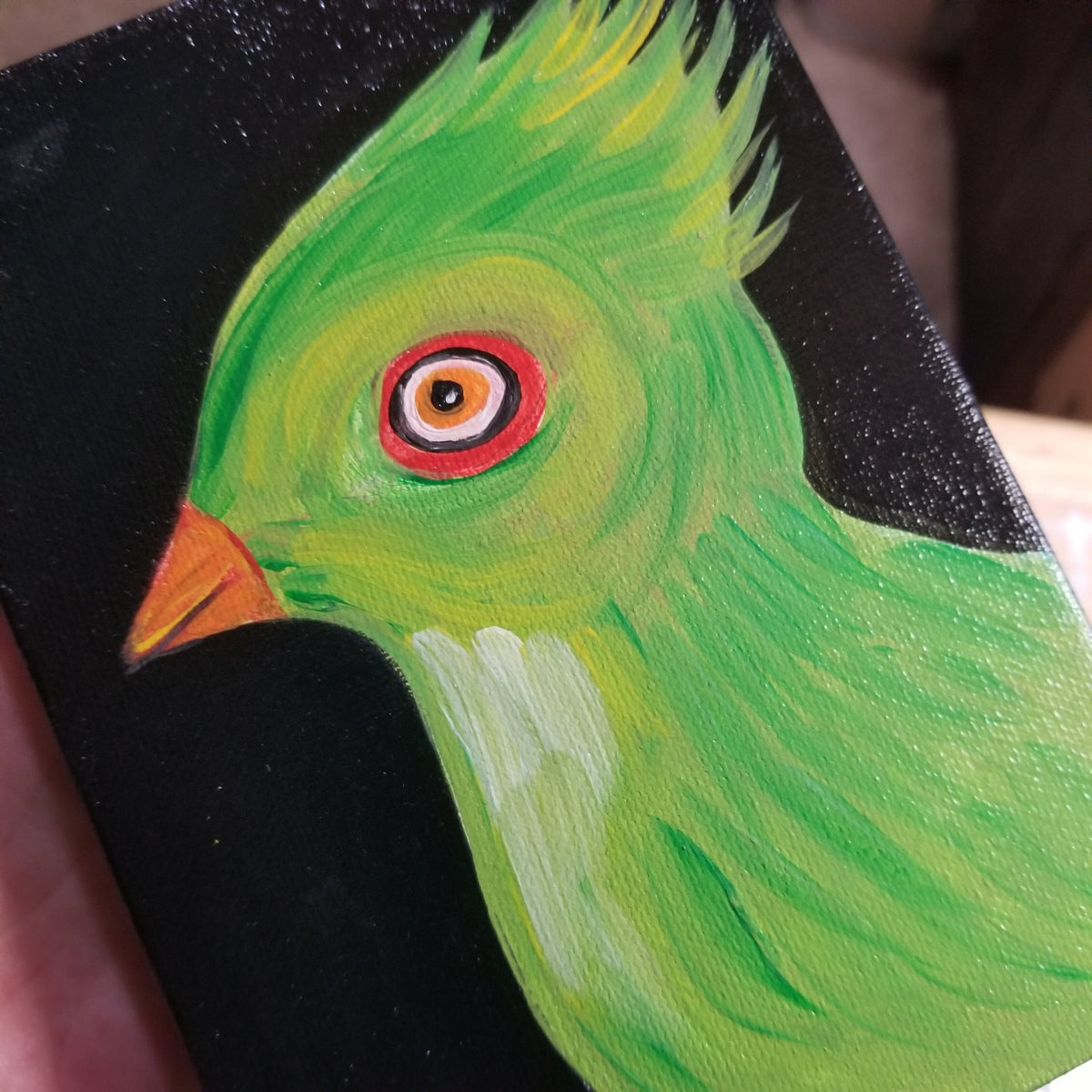Third view of the red eyed green bird original canvas, ready to hang unframed