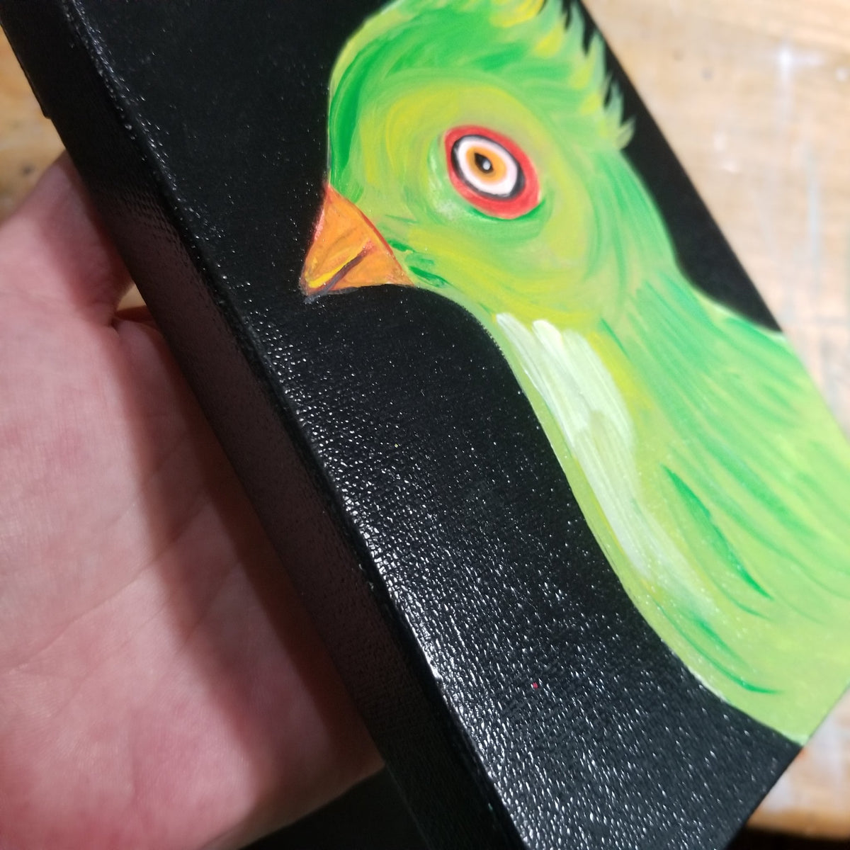 Second view of the red eyed green bird painting by Michele The Painter