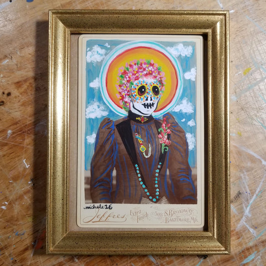 La Catrina painted in acrylic on a vintage postcard in an 8 by 6 inch gold frame by Michele The Painter