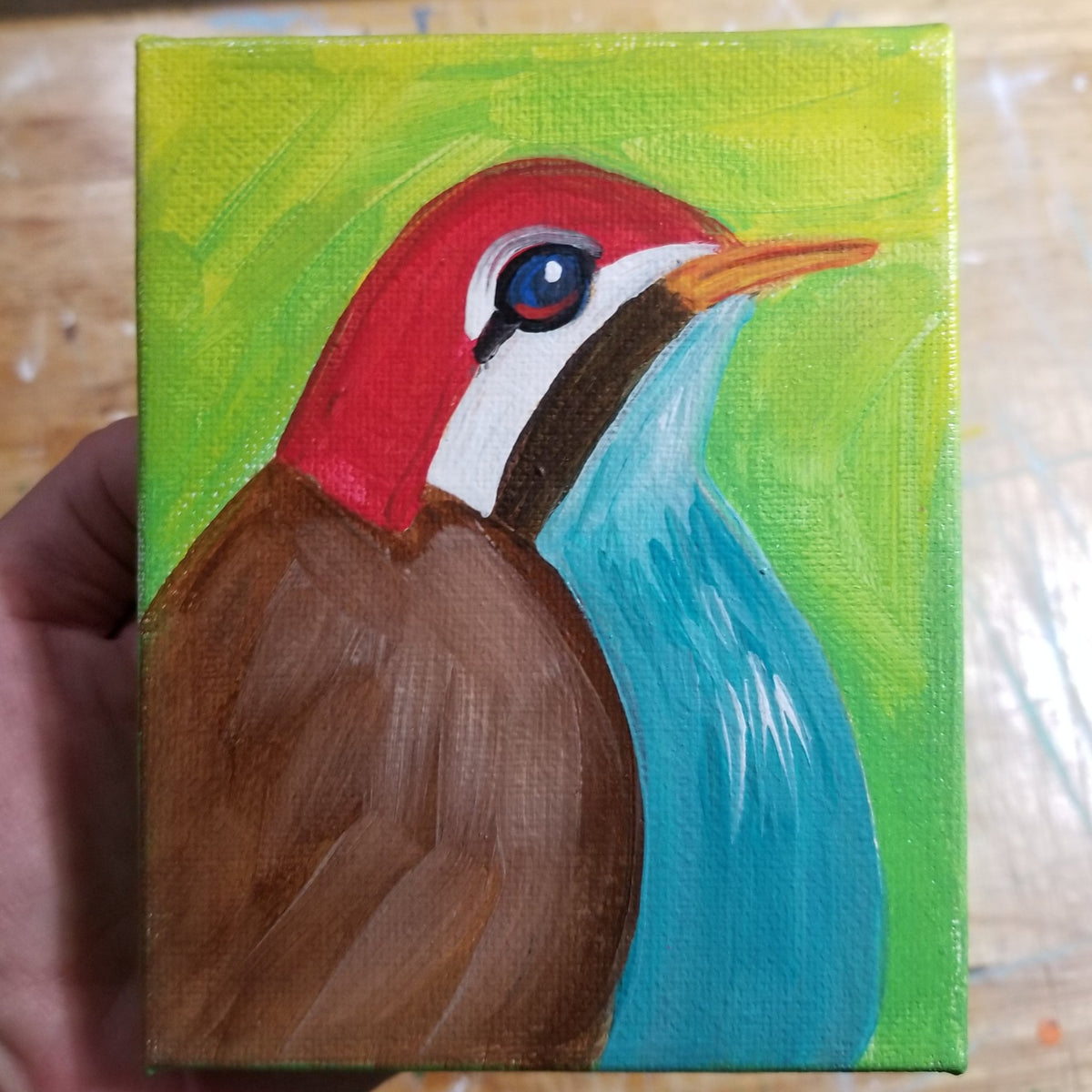 Final view of the red headed brown bird canvas painting by Michele The Painter