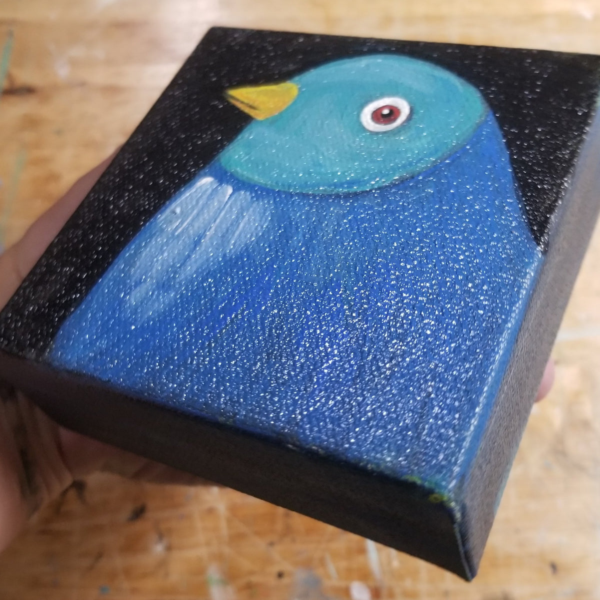 Third view of the two tone blue bird original on its petite canvas