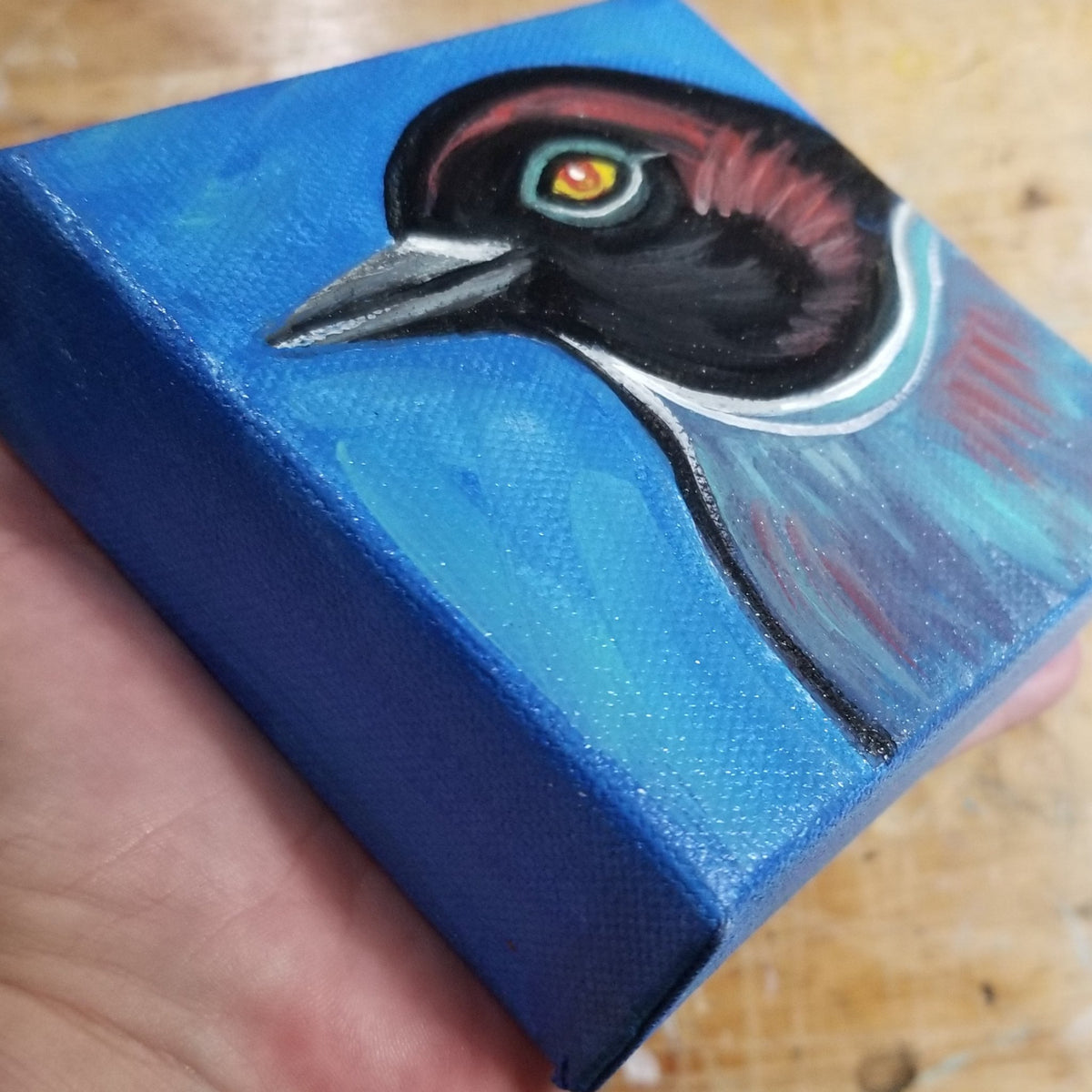 Third view of the black headed blue bird original, no frame required