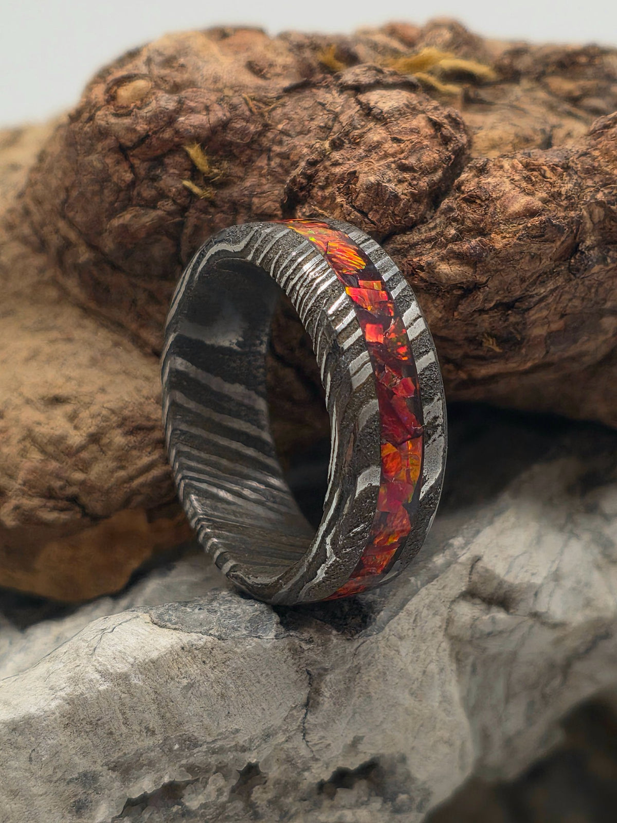 Carbon Damascus ring inlaid with mosaic ruby red opal by Cameron Senft Designs, size 10.5