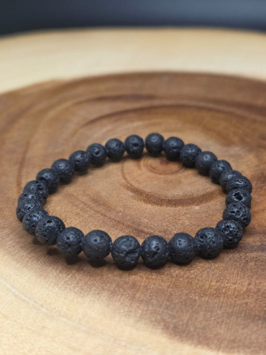 Simple stretch bracelet of 6mm black lava rock beads by Cameron Senft Designs, medium-small