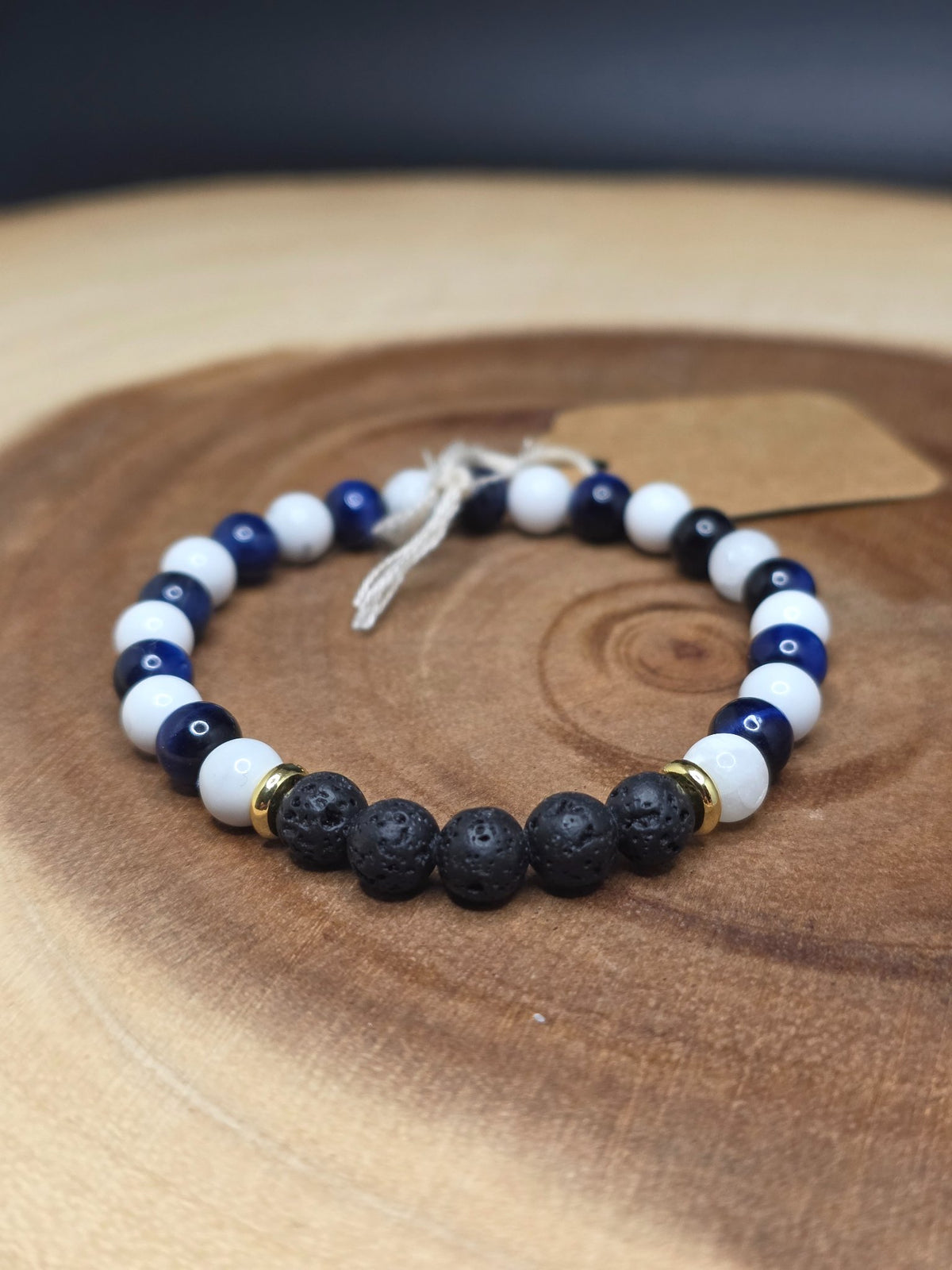 Howlite, dark blue tiger's eye and lava rock beaded bracelet with gold-plated spacers by Cameron Senft Designs