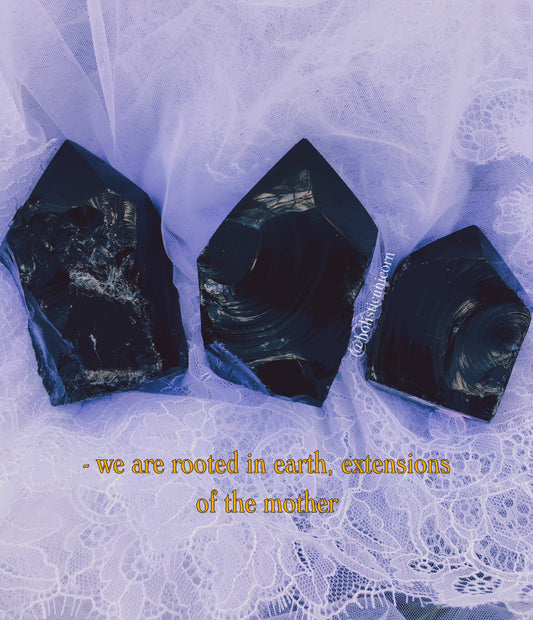 Polished black obsidian tower, a grounding and protective volcanic stone from Holistic Unicorn