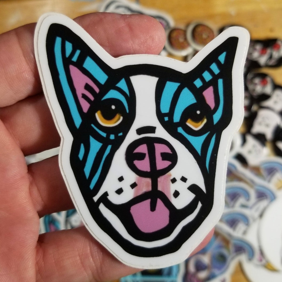 Three-inch vinyl sticker of a smiling dog in bright blue by Michele The Painter
