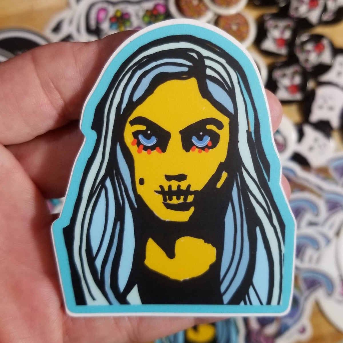 Vivid blue skull girl vinyl sticker, weather-resistant original art by Michele The Painter