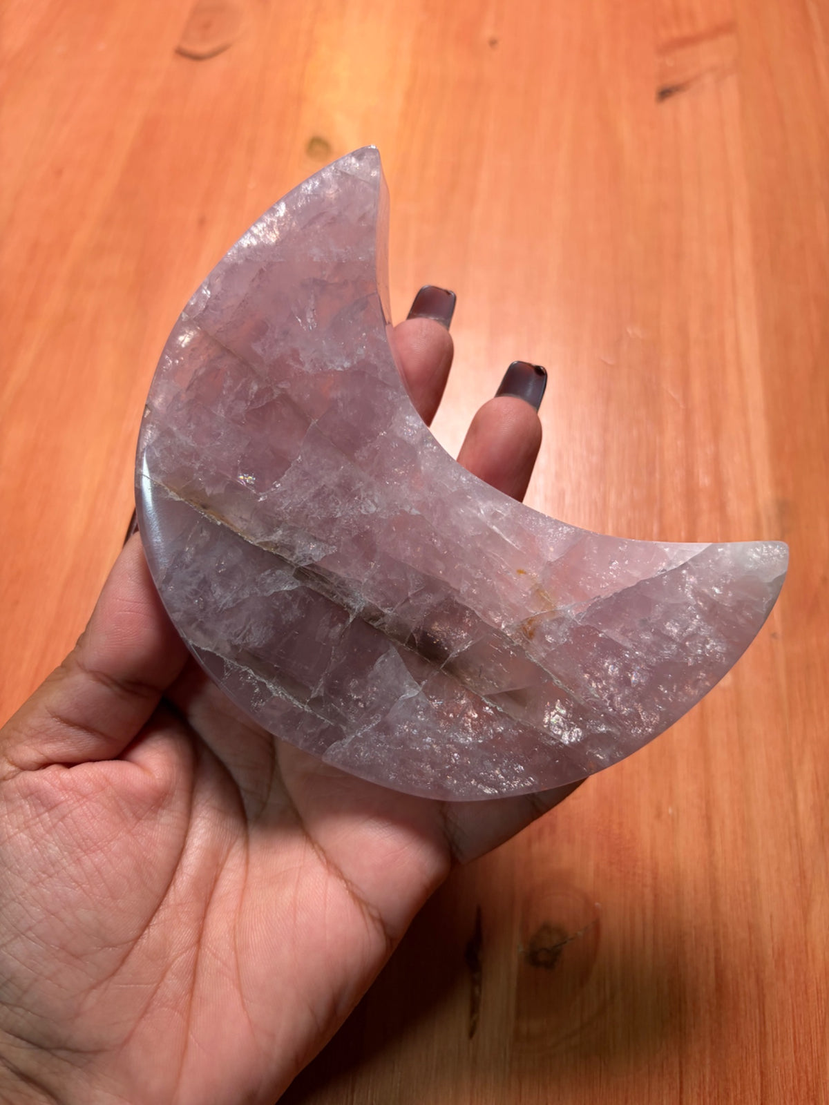 Second view of the rose quartz moon carving and its included stand