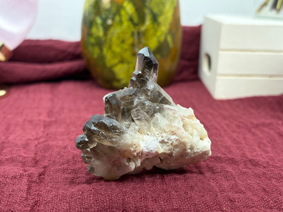 Another view of the smokey quartz cluster point showing its natural crystal facets