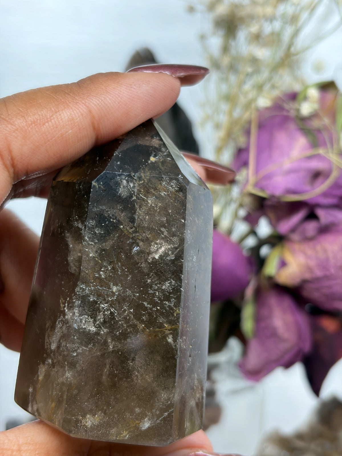 Polished smokey quartz tower from Madagascar, a grounding root chakra crystal by Holistic Unicorn
