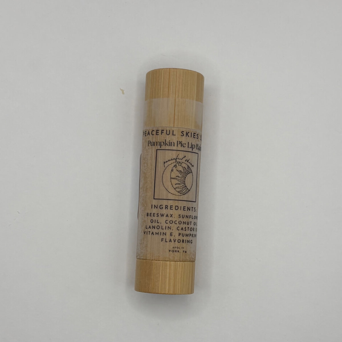 Seasonal pumpkin pie lip balm in a bamboo tube, handmade by Peaceful Skies
