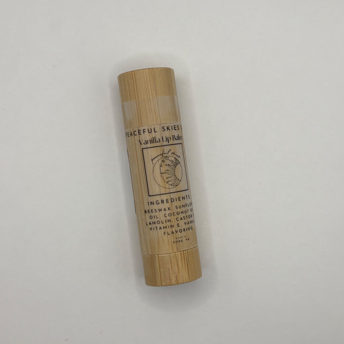 Vanilla lip balm in a pocket-sized bamboo tube, handmade by Peaceful Skies