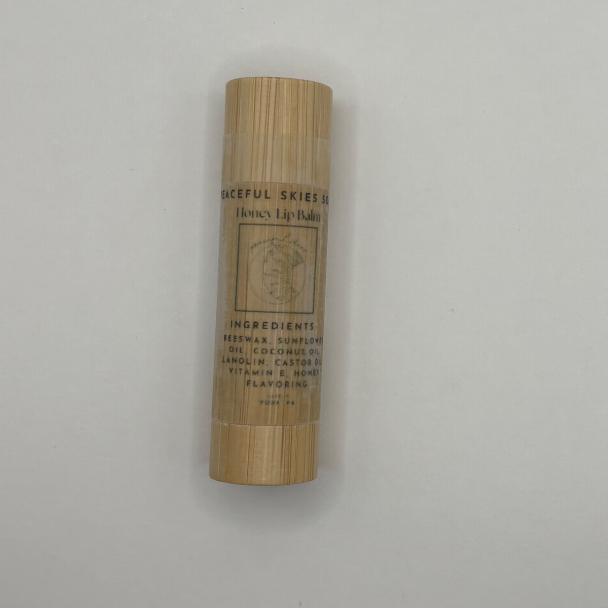 Honey lip balm made with locally sourced beeswax in a bamboo tube by Peaceful Skies