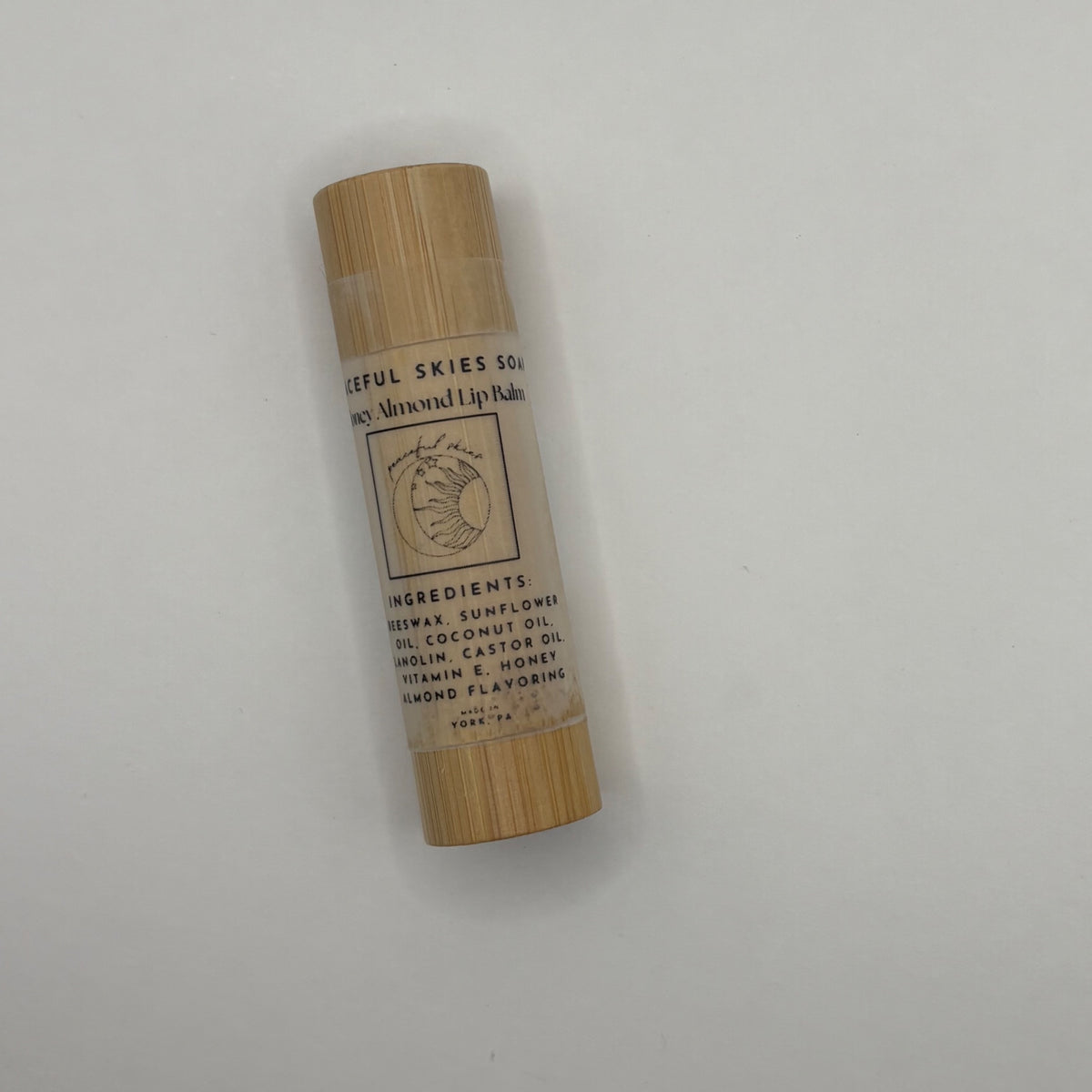 Honey almond beeswax lip balm in a natural bamboo container from Peaceful Skies
