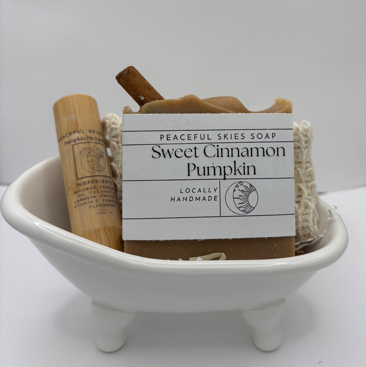 Gift set of Sweet Cinnamon Pumpkin soap, soap saver bag and pumpkin lip balm in a bathtub soap dish by Peaceful Skies