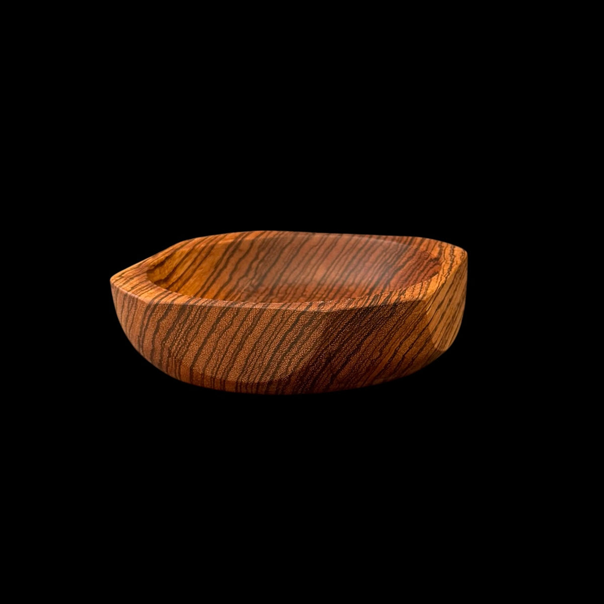 Zebrawood bowl with a faceted geometric rim showing high-contrast zebra striping by Sawdust Heaven