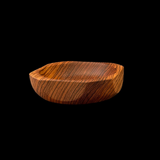 Zebrawood bowl with a faceted geometric rim showing high-contrast zebra striping by Sawdust Heaven