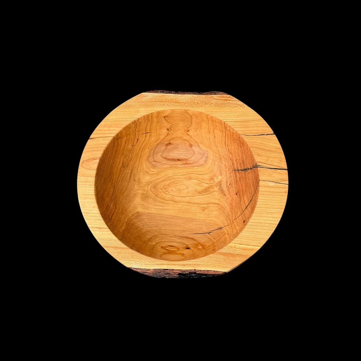 Second view of the cherry bowl with natural cracks stabilized in resin