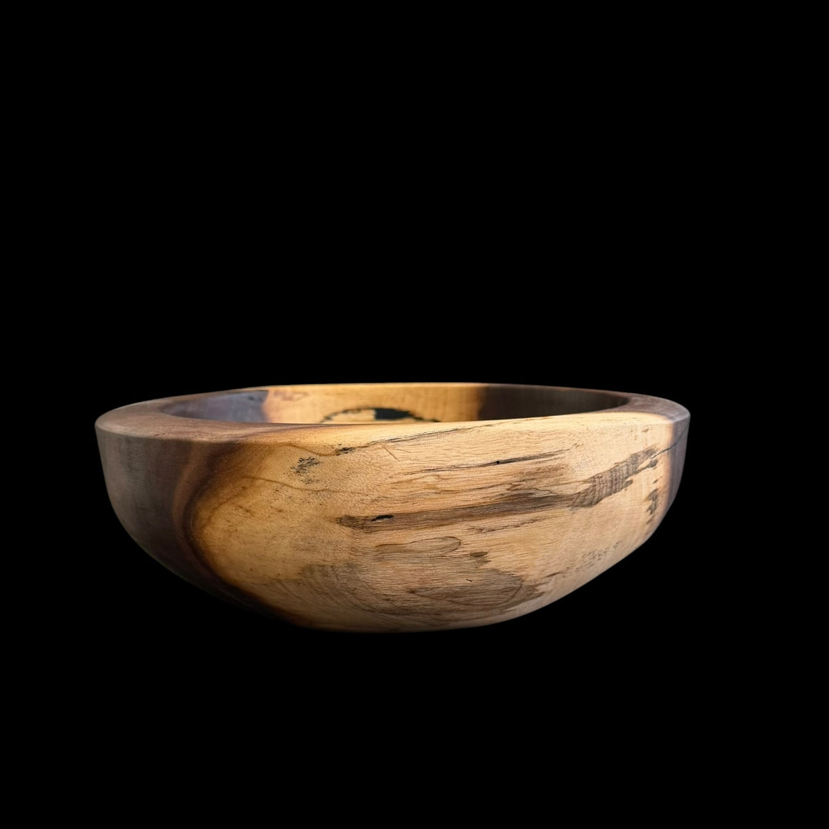 Second view of the black walnut bowl showing its dramatic central knot