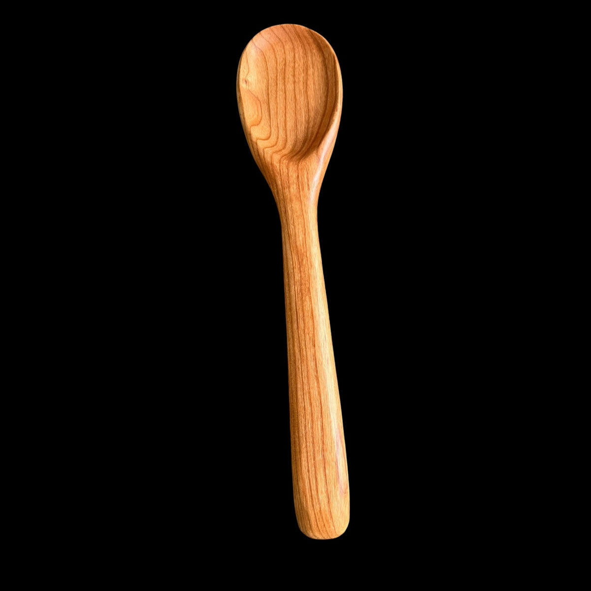 Carved cherry wood spoon finished over a 60 day process by Sawdust Heaven