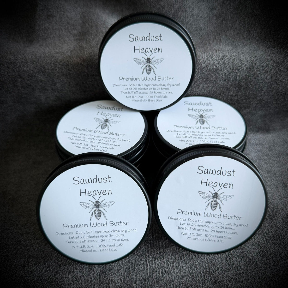 Two ounce tin of wood butter made from mineral oil and beeswax by Sawdust Heaven
