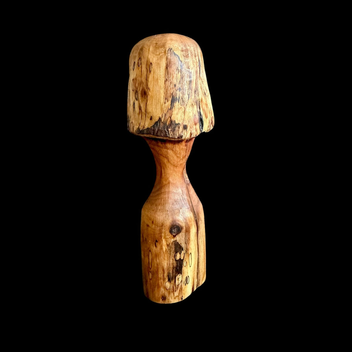 Hand-carved cherry wood mushroom, 6.5 inches tall, showing natural grain and knots, by Tina