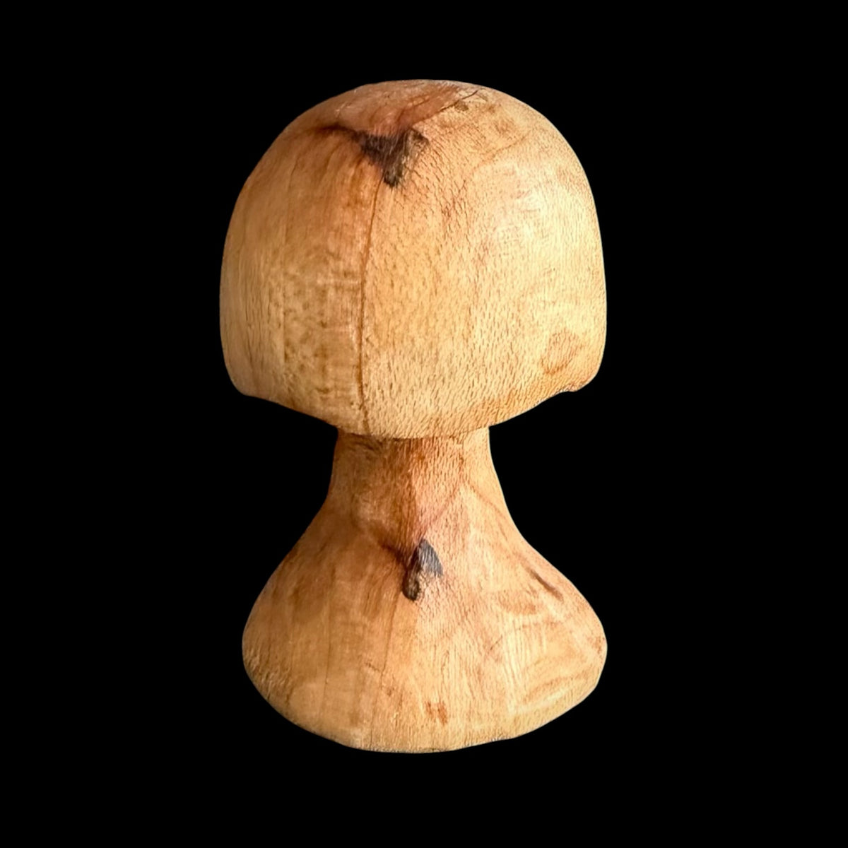 Chunky mini cherry wood mushroom with golden-red tones and dark character marks by Tina