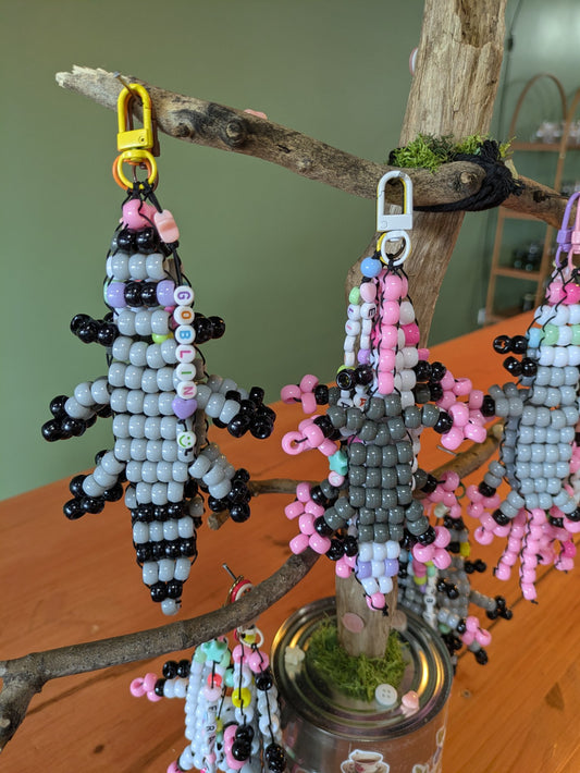Feral critter keychain made from pony beads on nylon string with a clasp, by Jaimee Crash Art