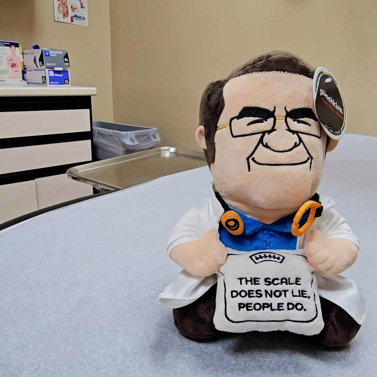 Officially licensed Dr. Now plush in white coat holding a scale that says The Scale Does Not Lie People Do by Punchkins, view 6