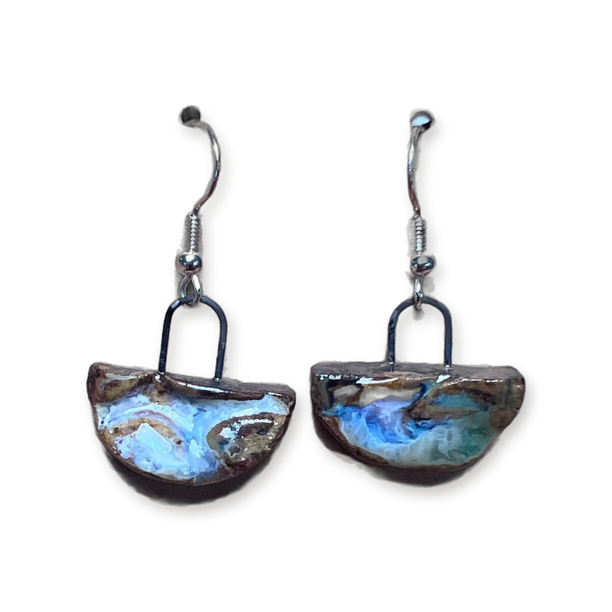 Handmade half moon ceramic earrings in blue river glaze on sterling silver hooks by ABeYOUtifulMind