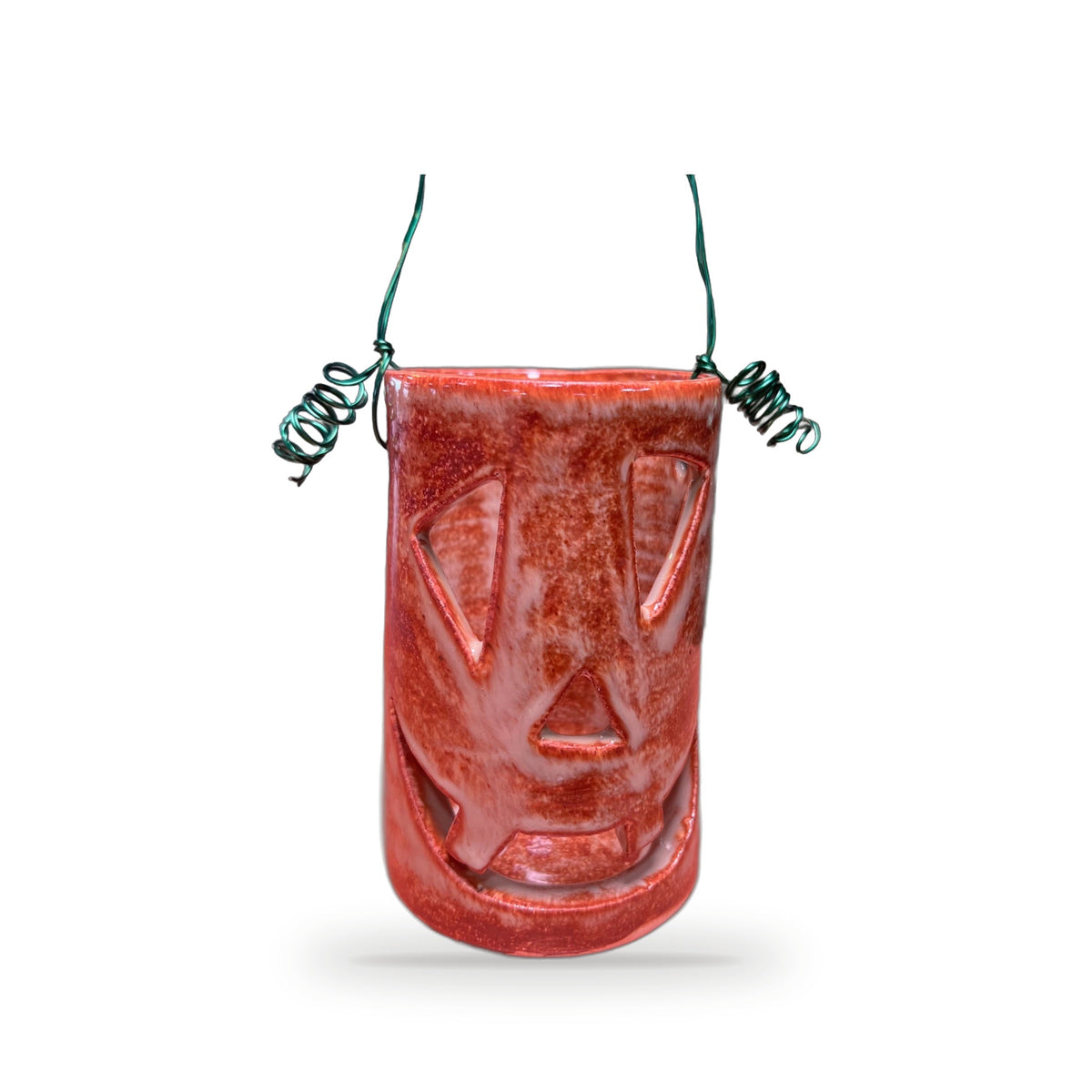 Handmade rust red speckled clay Halloween lantern with carved face and curly green wire handle by ABeYOUtifulMind