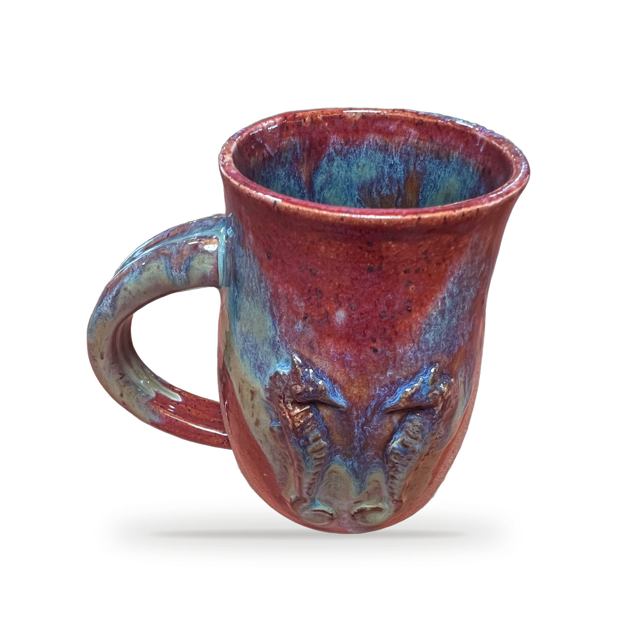 Handmade ceramic sea horse mug in red and blue flowing glaze with sculpted sea horse face by ABeYOUtifulMind