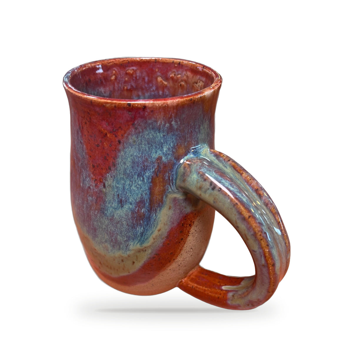 Sea Horse Mug side view showing curled sea horse tail handle and blue-red glaze