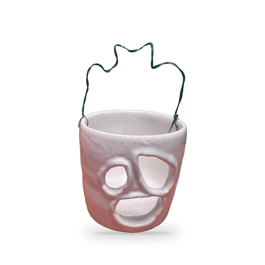 Small handmade white ceramic ghost luminary with cutout ghost face and wavy green wire handle by ABeYOUtifulMind