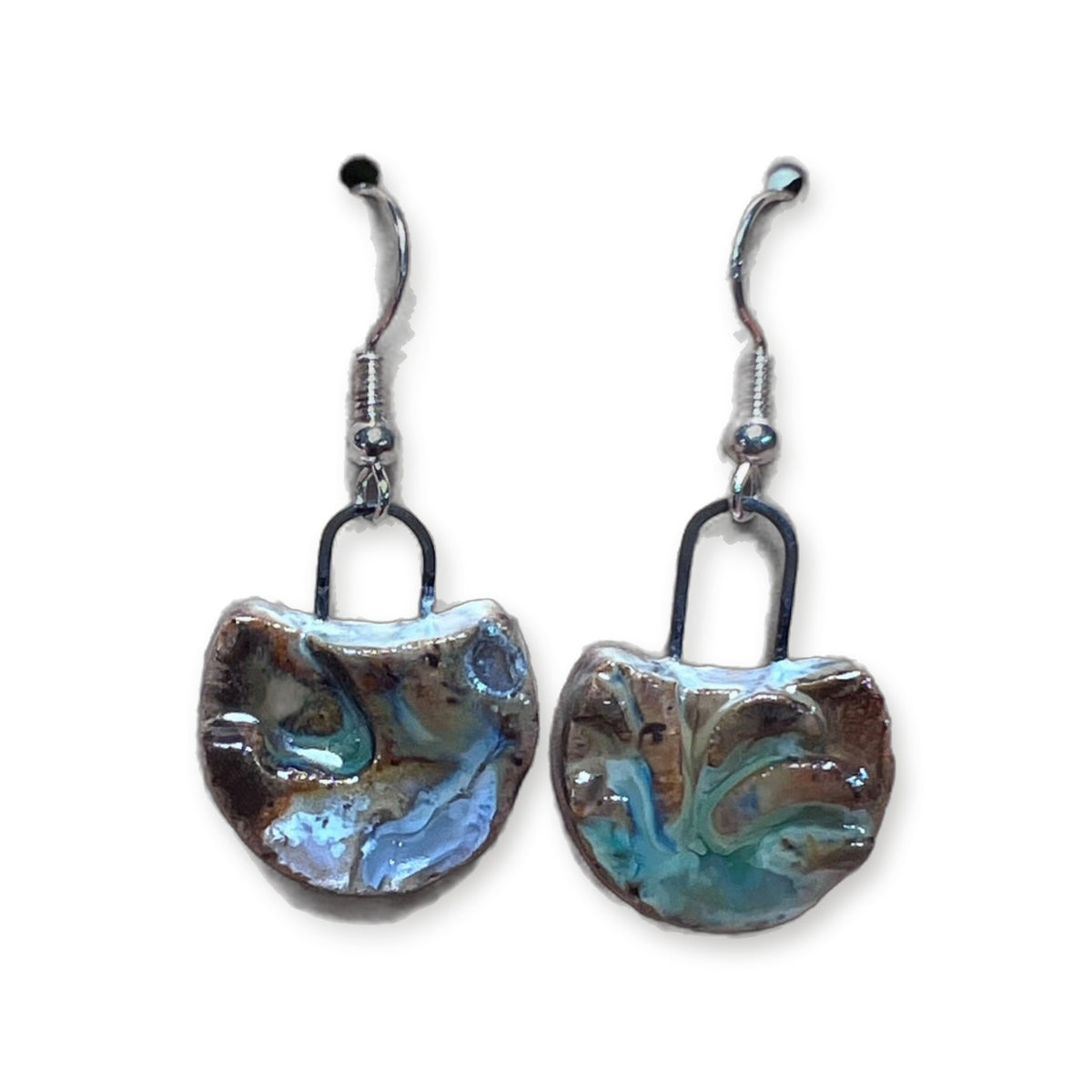 Handmade waxing moon ceramic earrings in multicolor teal, blue, and brown glaze on sterling silver hooks by ABeYOUtifulMind