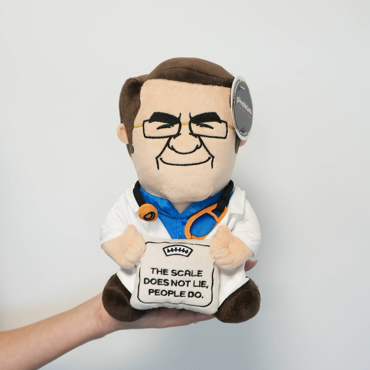 Officially licensed Dr. Now plush in white coat holding a scale that says The Scale Does Not Lie People Do by Punchkins, view 4