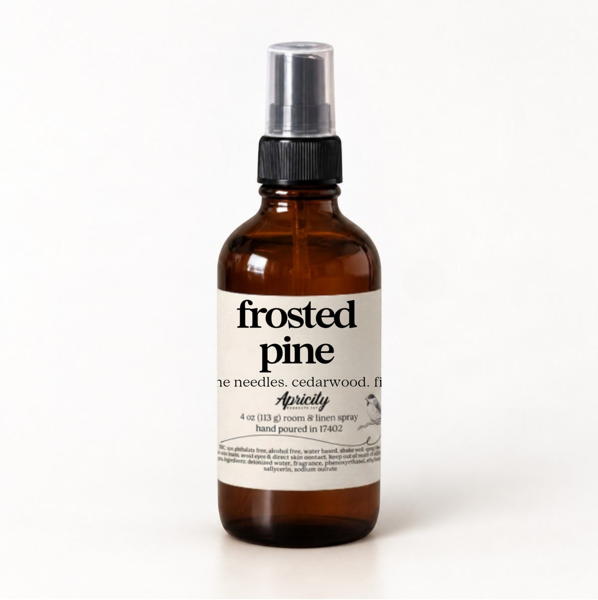 Frosted Pine room and linen spray in a 4 oz amber glass bottle with a fine mist sprayer